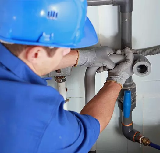 plumber carrying out plumbing repairs